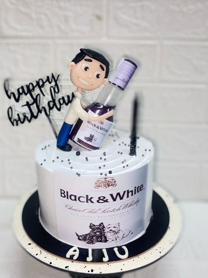 For the birthday boy and his favourite drink. This pineapple cake is designed to look like a Black & White whisky bottle, complete with a custom caricature.