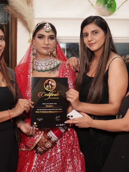 Another one of my students, Khushboo, looking stunning in her final bridal look and holding her certificate.
