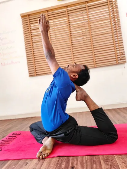 A variation of One-Legged King Pigeon Pose, focusing on a deep quadriceps stretch and backbend.