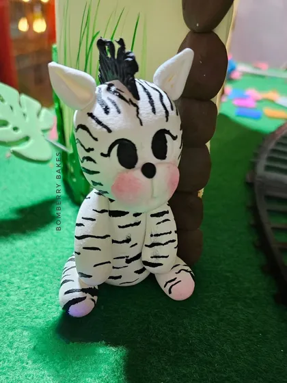 A close-up of the adorable baby zebra figurine.