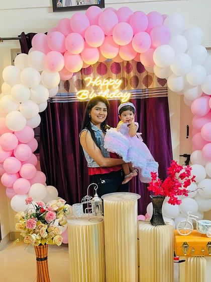 Holding my daughter in her beautiful birthday gown. She looked like a little doll.