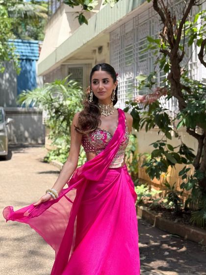 A candid, in-motion shot that shows how the outfit and makeup look in natural daylight.