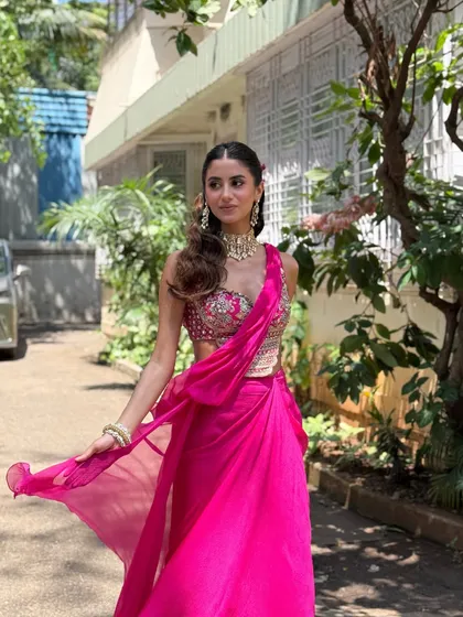 Soft smoked eyes and dewy skin for this stunner in a vibrant pink outfit. This look is perfect for a guest or a bridesmaid who wants to look glamorous.