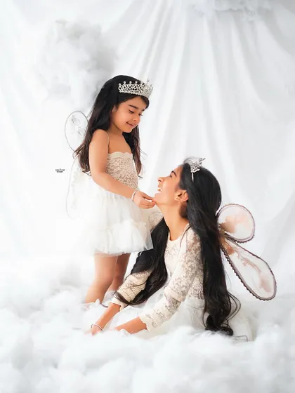 A sweet, interactive moment between two fairy sisters in their magical cloud kingdom.