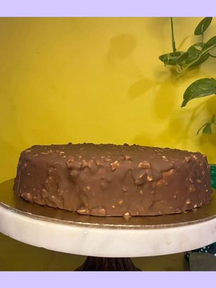 My Almond Rocher cake is a celebration of texture and flavor. It features crunchy almond layers that envelop a rich, velvety chocolate center. It’s one of my signature cakes and a true indulgence.