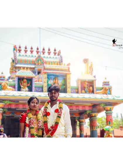 A classic portrait captured right outside the temple after the wedding ceremony. I know how important the temple setting is in South Indian weddings, and I make sure to get beautiful shots that include the traditional architecture.