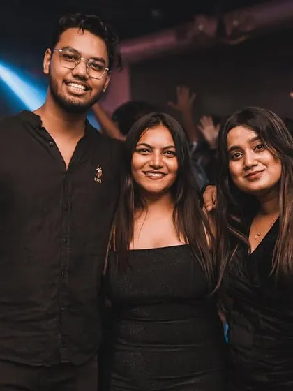 Friends posing for a picture amidst the party. My events are the perfect backdrop for making new memories.