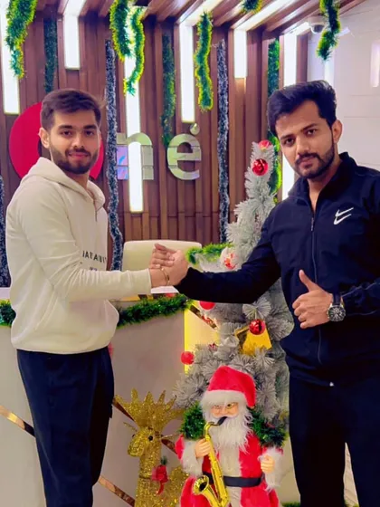 A handshake between a member and a trainer symbolizes the partnership and teamwork that defines our approach to personal training and community building.