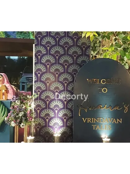 A welcome sign with elegant gold lettering for "Amaira's Vrindavan Tales."