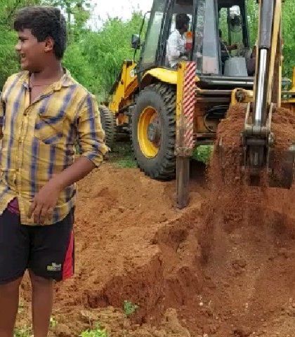 The first step in building a mud house is sourcing the right soil. Here, we are excavating local 'Salliman' soil directly from the farm site. The excavated pit will later be used as a rainwater harvesting pond.