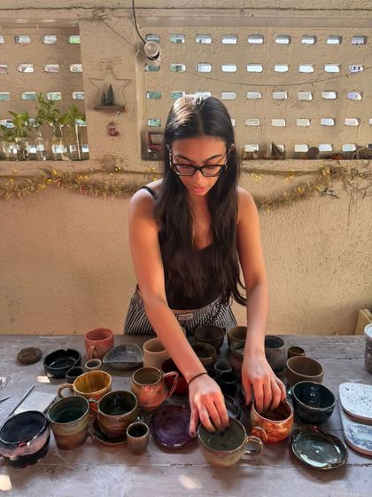 This is Hithika, one of our amazing teachers, getting her beautiful handmade mugs ready for a market sale. She brings so much warmth and energy to our studio, both as a teacher and a potter.