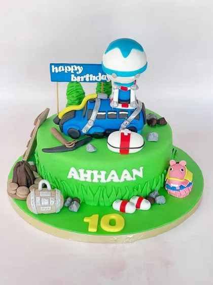 It's game on for Ahhaan's 10th birthday with this Fortnite-inspired cake. The design includes iconic elements from the game, like the battle bus and a treasure chest.