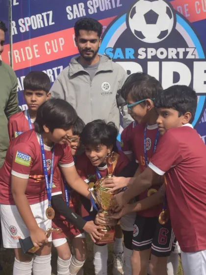 The pure joy of achievement. Our U-11 players celebrating with the Runners-Up trophy at the Pride Cup, a moment earned through teamwork and perseverance.
