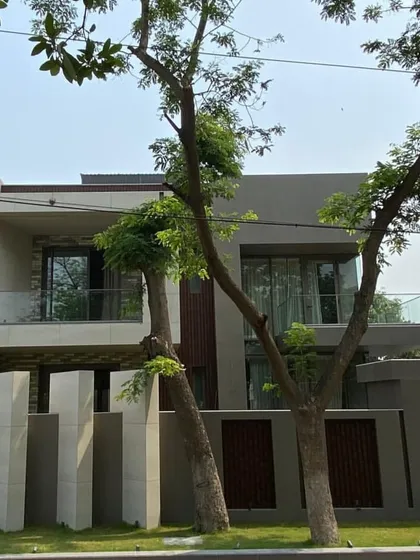 A street-level view of the completed Gurgaon villa. This image captures the front elevation with its clean lines and material palette, matching the architectural intent established in our 3D design phase.