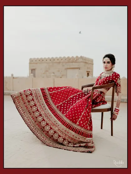 A bride reigning over her kingdom. This powerful portrait of Sonakshi at Suryagarh, Jaisalmer, uses the stark, beautiful landscape to create a sense of modern royalty.