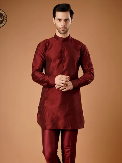 A deep maroon silk kurta set, offering a rich and royal look that is both simple and powerful.