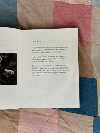 A sample from our bookshelf: 'The Book of Hygge'. We hope you feel a sense of hygge, or cozy contentment, at our events and in our space.