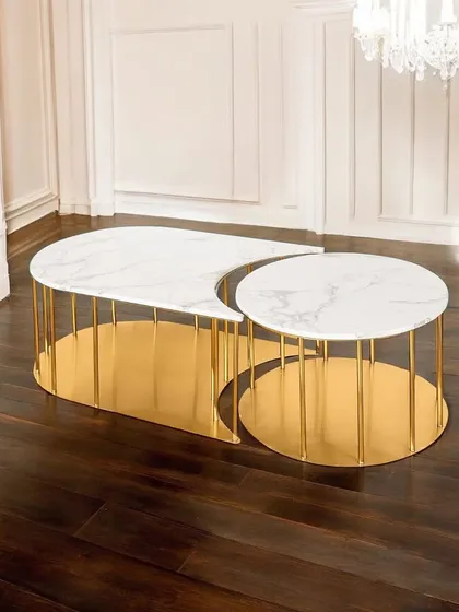 The Aristocrat Aura coffee table is an exquisite choice for home decoration. Its unique crescent and circle design allows the two parts to nest together or be used separately, offering stunning aesthetics and practical functionality.