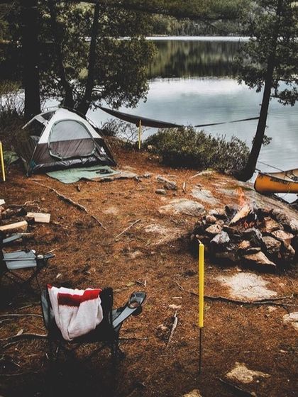 This is a typical setup at one of my lakeside spots near Bangalore. A comfortable tent, a hammock strung between trees, a canoe by the dock, and a campfire ready to be lit. It’s your perfect private getaway for the evening.