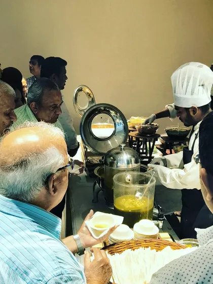 Guests love to watch their food being made. A bustling live counter like this one adds a dynamic and engaging element to any gathering, ensuring your event is memorable.