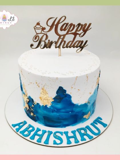 A repeat of the sophisticated blue and gold watercolor cake for Abhishrut's birthday.