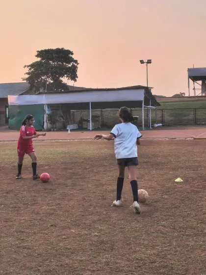 Two of our female players practicing their one on one skills. We ensure every player gets dedicated attention to improve their technique, from defensive stances to offensive moves.