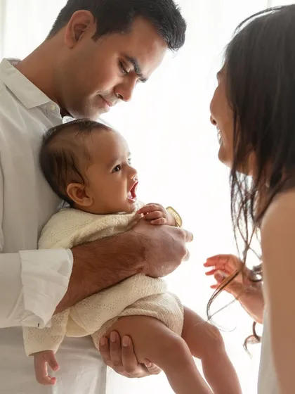 A moment of sweet conversation between parents and their baby. I love capturing these simple, everyday interactions that show the depth of a family's bond.