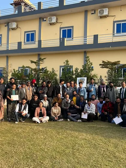 A large group photo of all the participating artists from across the country at the camp in Ajmer.