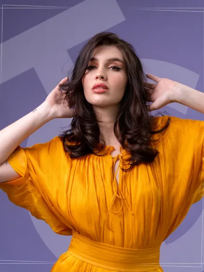This style features soft, voluminous curls on medium-length hair, created during a masterclass with Bill Watson. The look is both romantic and modern, showcasing the versatility of our styling techniques for different hair lengths and textures.