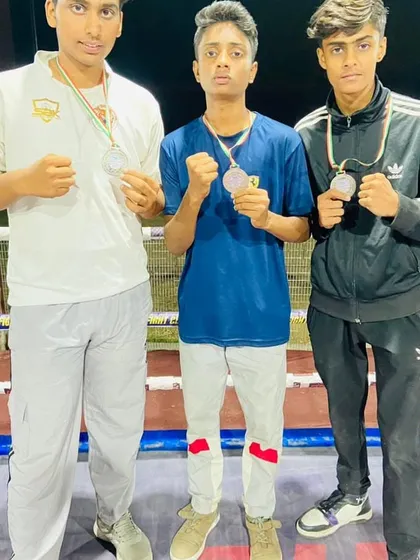 My boxers proudly showing their silver medals. We teach them to fight with heart, whether they win or lose.