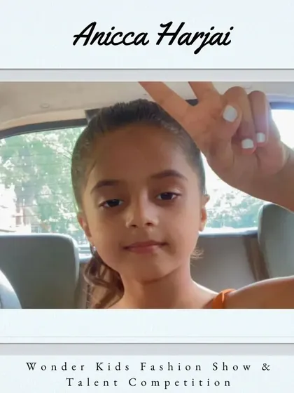 A warm welcome to Anicca Harjai. Her peace sign and confident look mean she's ready for the stage.