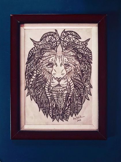The face of a lion, created with dozens of different zentangle patterns to form its majestic mane.