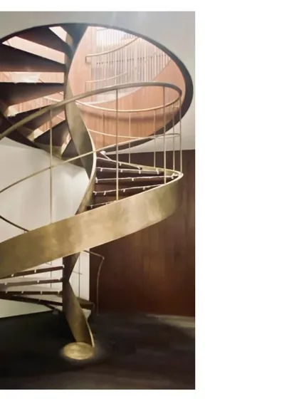 We believe details make the project. This spiral staircase is more than a way to move between floors; it is a sculpture of aged brass, a ribbon of metal crafted to be as satisfying to the hand as it is to the eye.