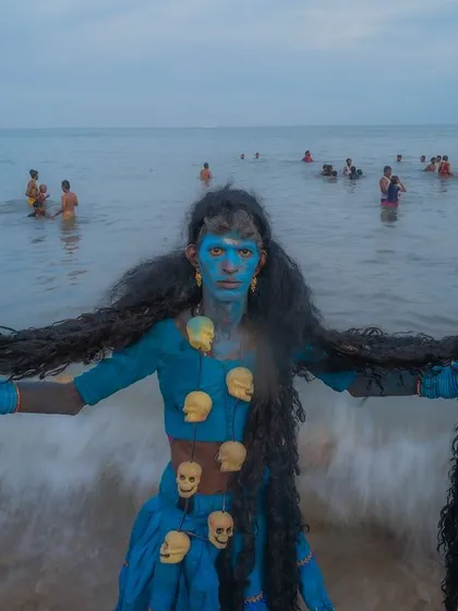 A devotee embodying the fierce energy of Goddess Kali emerges from the sea during the Kulasai Dasara festival in Tamil Nadu. This is the raw power of faith I chase, a moment of complete transformation.