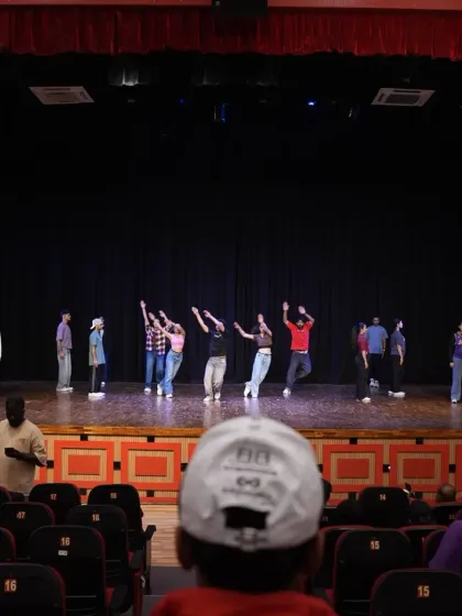 A view from the audience during final rehearsals. It's a unique perspective on the hard work that goes into every performance.