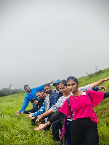 A fun group photo on the grassy slopes of Kurinjal peak.