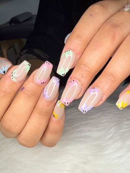 A close-up of the multi-colored pastel butterfly wing nail art.
