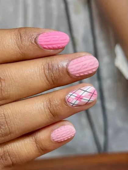 A different angle of the cute and cozy pink sweater nails.