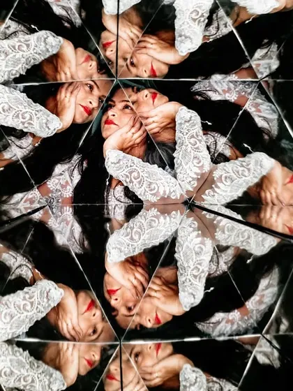 A beautiful and intricate bridal portrait created with a kaleidoscope. This artistic technique creates a stunning, mesmerizing pattern that highlights the bride's features and lace details.