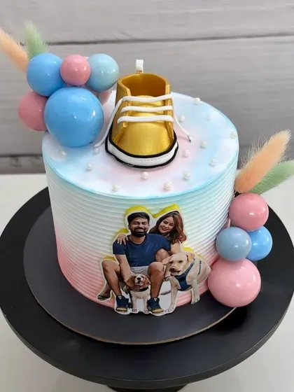 Welcoming a little one with a bumper treat. This Nutella mousse cake features a photo of the parents-to-be and their furry friends.
