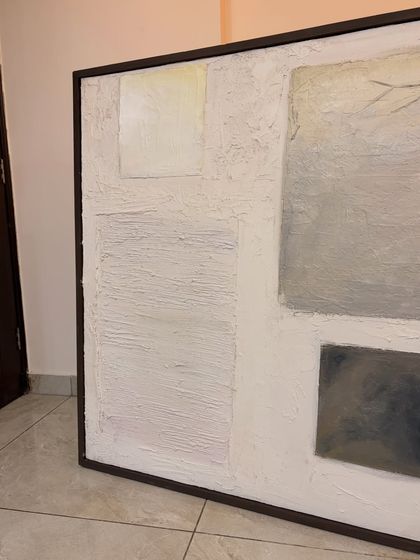 The finished 4ft x 4ft textured artwork, framed and ready to go. The dark frame provides a sharp contrast to the white and grey tones of the abstract composition.