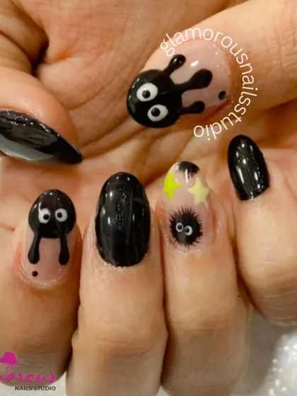A fun, Ghibli-inspired set for the anime lover. We hand-painted these cute little "soot sprites" on a black and nude base, creating a look that is both edgy and adorable.