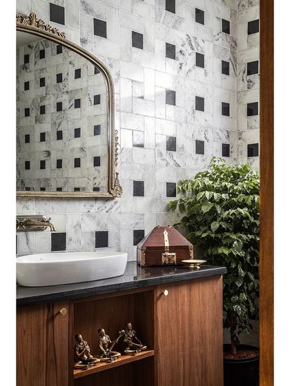 The master bathroom in Prangan showcases our love for timeless patterns, using black and white marble to create a classic yet bold statement.