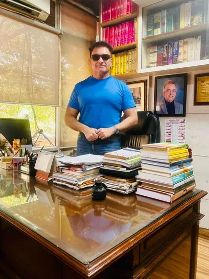 At my desk, where strategies are formed and cases are built. The portrait of my father behind me is a constant source of inspiration.