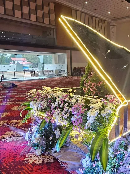 We love to bring unique ideas to life. This custom-made grand piano prop, filled with an overflowing arrangement of exotic flowers and illuminated with soft lighting, served as a stunning and modern centerpiece for a reception.