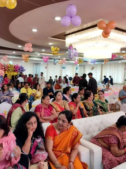 A view of the guests seated and enjoying the festivities at Bhumi and Kunjan's baby shower. I can manage crowds of over 200 people, ensuring everyone has a comfortable and enjoyable experience.