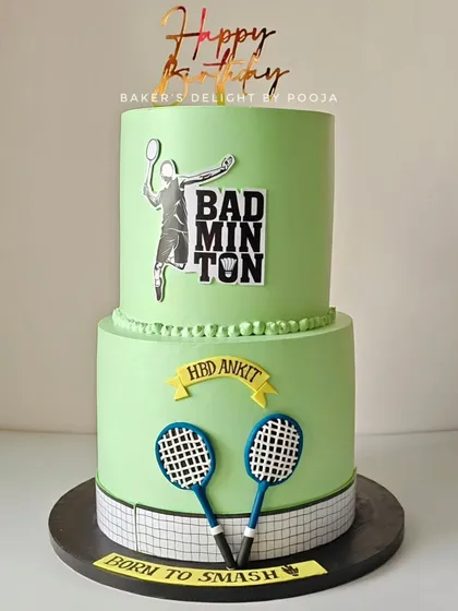 This two-tier badminton-themed cake was a surprise for a groom who is passionate about the sport. The design features rackets, a net, and a player silhouette, turning a wedding reception cake into a personal birthday celebration.