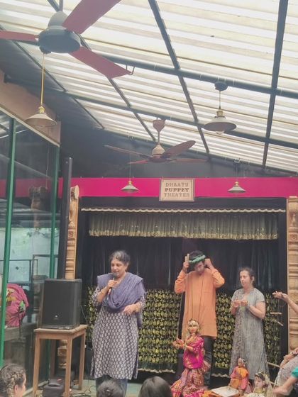 An interactive moment during a workshop where students get to handle the puppets themselves. This hands-on approach is key to our teaching philosophy, making learning memorable and fun.