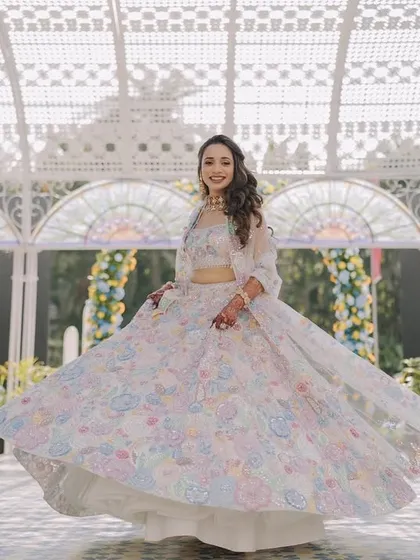 The bride, Aashvi, looking radiant in the glasshouse we designed for her Haldi. The natural light and colorful decor created the perfect backdrop for her portraits.