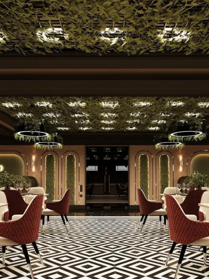 A perspective shot showing the depth of the restaurant, with the bold flooring leading the eye through the space. The design uses symmetry and repetition in its lighting and architectural details to create a cohesive look.